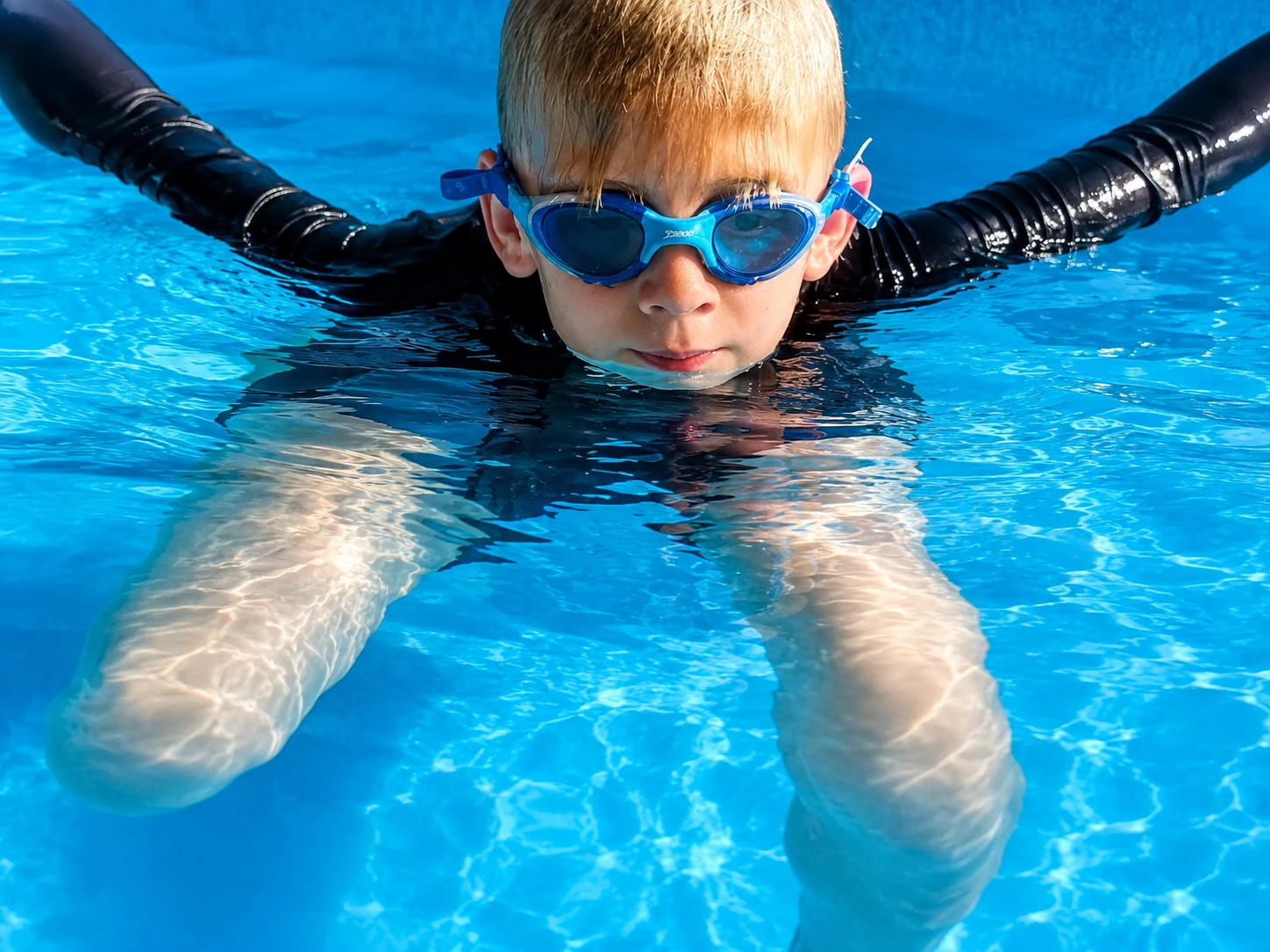 Young swimmer in the water during a Swimtrain lesson